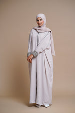 Load image into Gallery viewer, Embellished pearl gray abaya with handwork and olive piping.