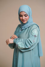 Load image into Gallery viewer, Organza flower embellished luxury abaya with hand and back embellishments.