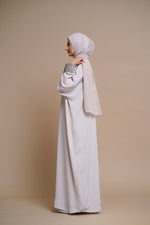 Load image into Gallery viewer, Embellished pearl gray abaya with handwork and olive piping.
