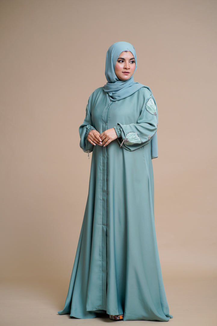 Organza flower embellished luxury abaya with hand and back embellishments.