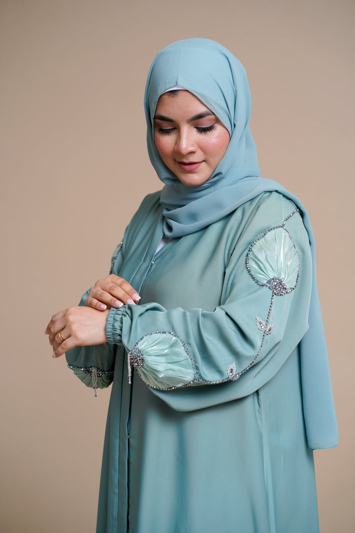 Organza flower embellished luxury abaya with hand and back embellishments.