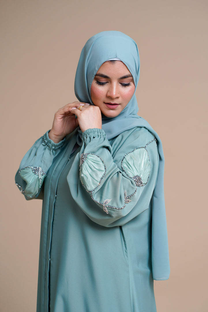 Organza flower embellished luxury abaya with hand and back embellishments.