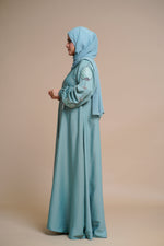 Load image into Gallery viewer, Organza flower embellished luxury abaya with hand and back embellishments.
