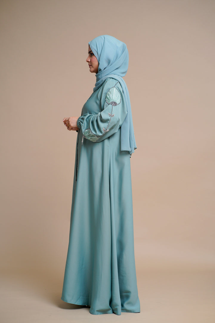 Organza flower embellished luxury abaya with hand and back embellishments.